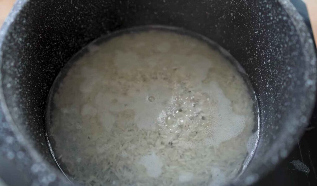 Boil rice for bowl cheeseburger