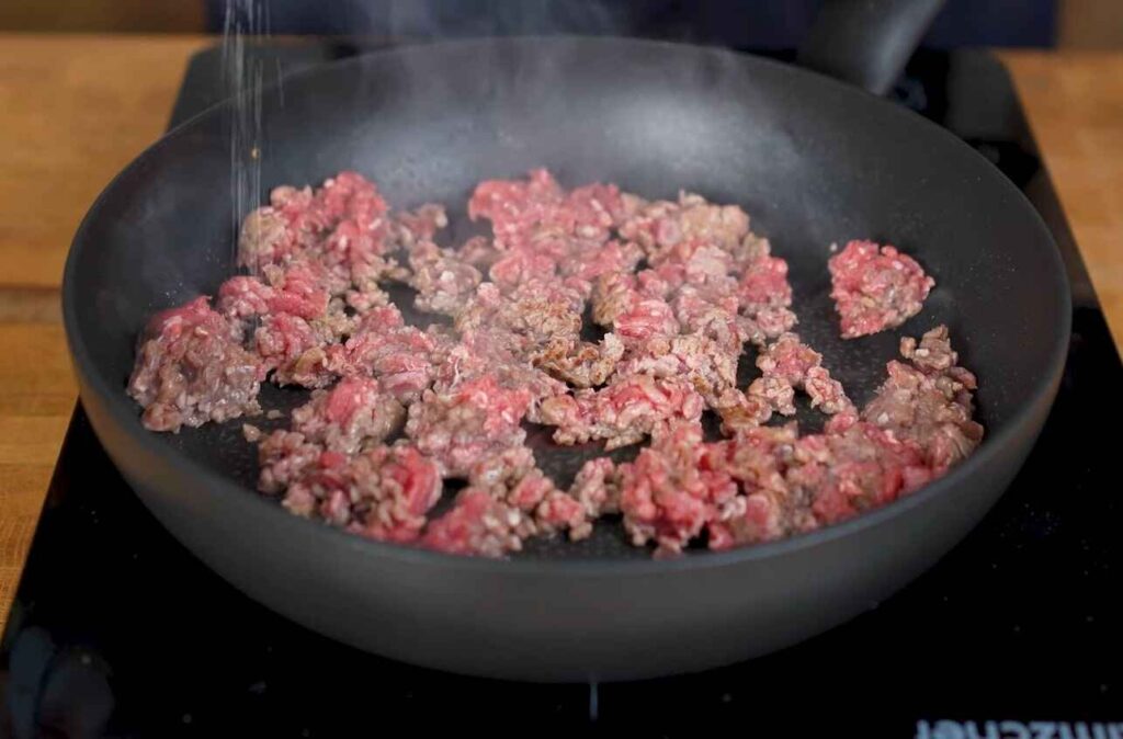 ground beef cooking for cheese burger